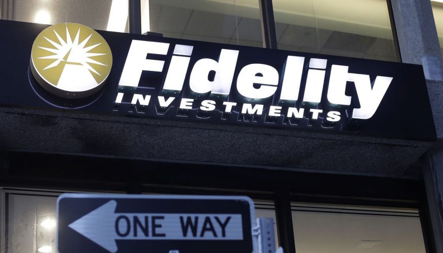 A Fidelity Investments logo is attached to a building, in Boston.