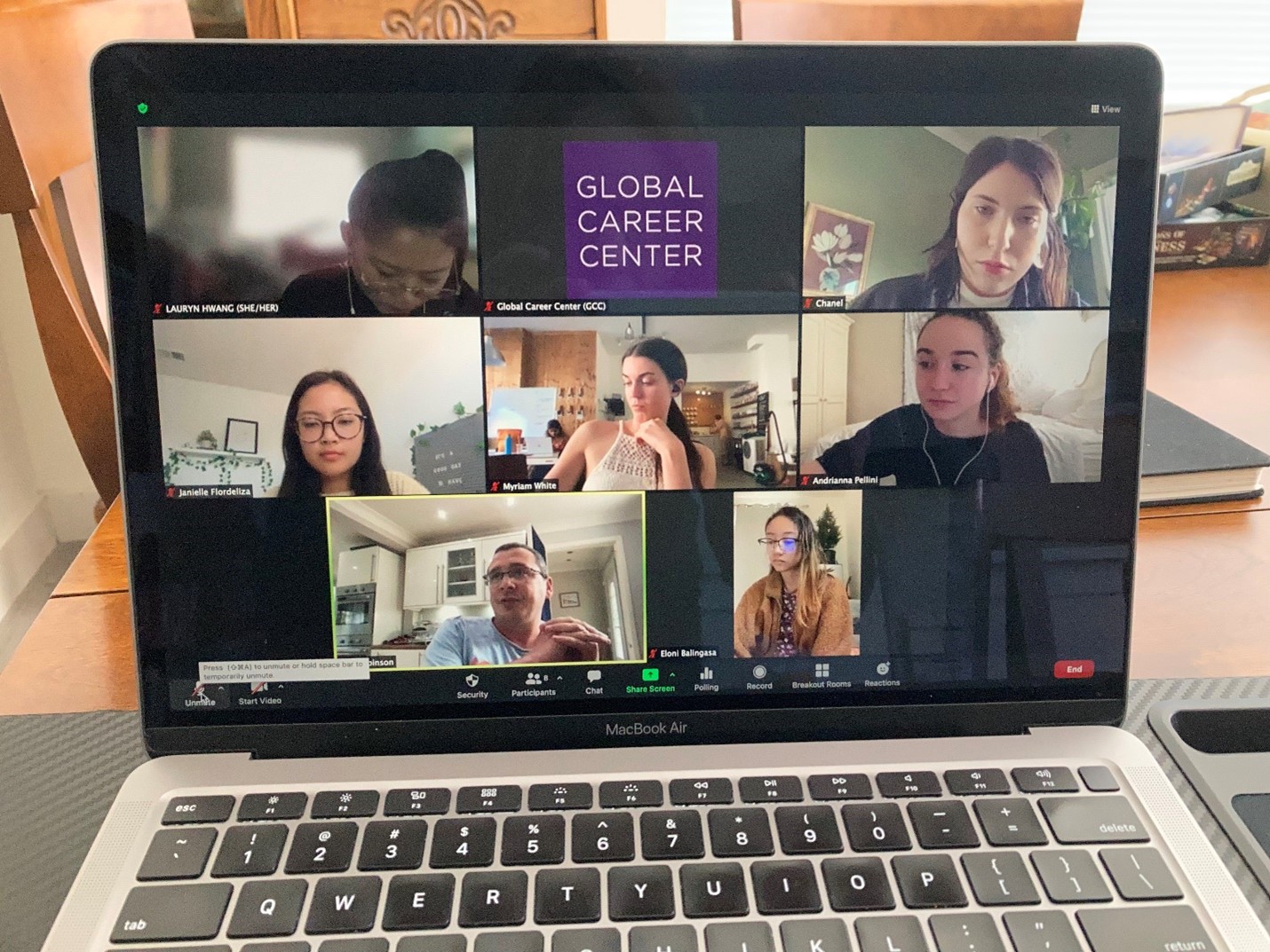 laptop screen of a Zoom call with participants 